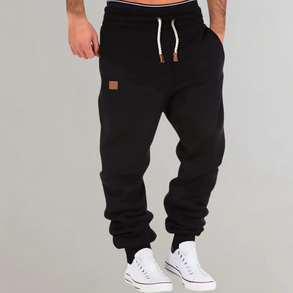 Belro men's jogging pants in black, made from comfortable activewear fabric, with elastic waistband and side pockets.