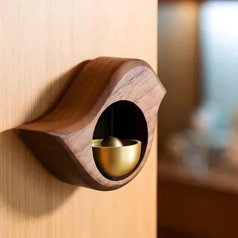 Belro wooden door chime with sleek electronic design, mounted on a wall near a door, blending modern smart home style.