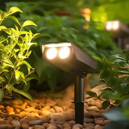 Belro Solar LED Multi-Zoom Spot Light illuminating a garden area with adjustable focus in an outdoor home and garden setting.