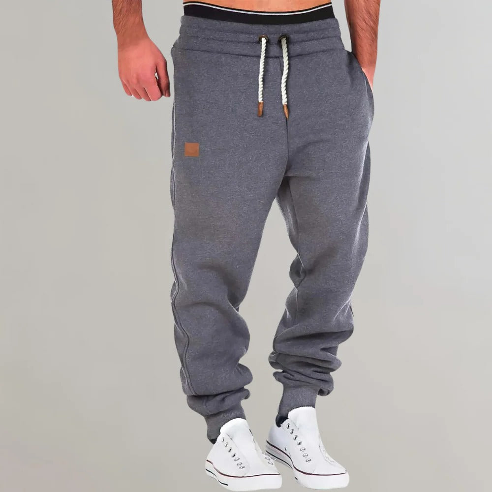 Belro men's jogging pants in gray activewear, featuring an elastic waistband and relaxed fit for comfortable casual wear.