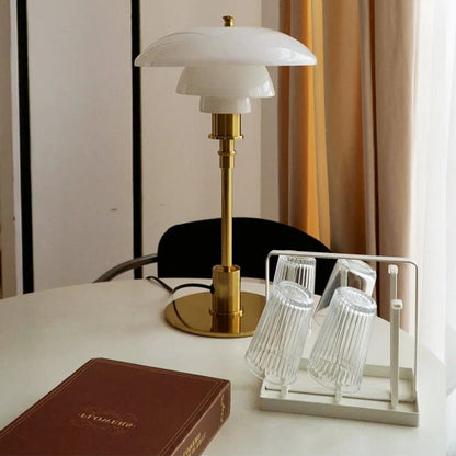 Scandinavian LED Belro desk lamp with modern design, white finish, and adjustable arm on a wooden desk.