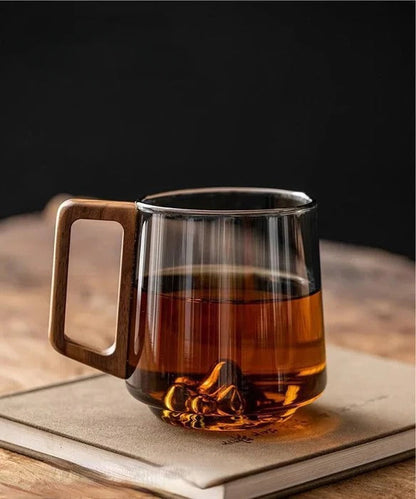 Elegant glass cup with handle by Belro for kitchen and dining, showcasing a clear, stylish design suitable for beverages.