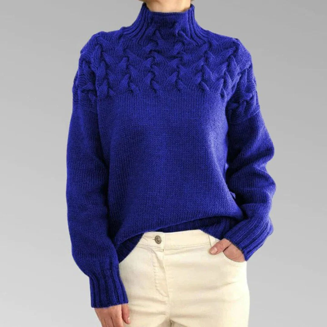 Women's knitted turtleneck sweater by Belro, featuring soft, cozy fabric and a classic design in a neutral color.
