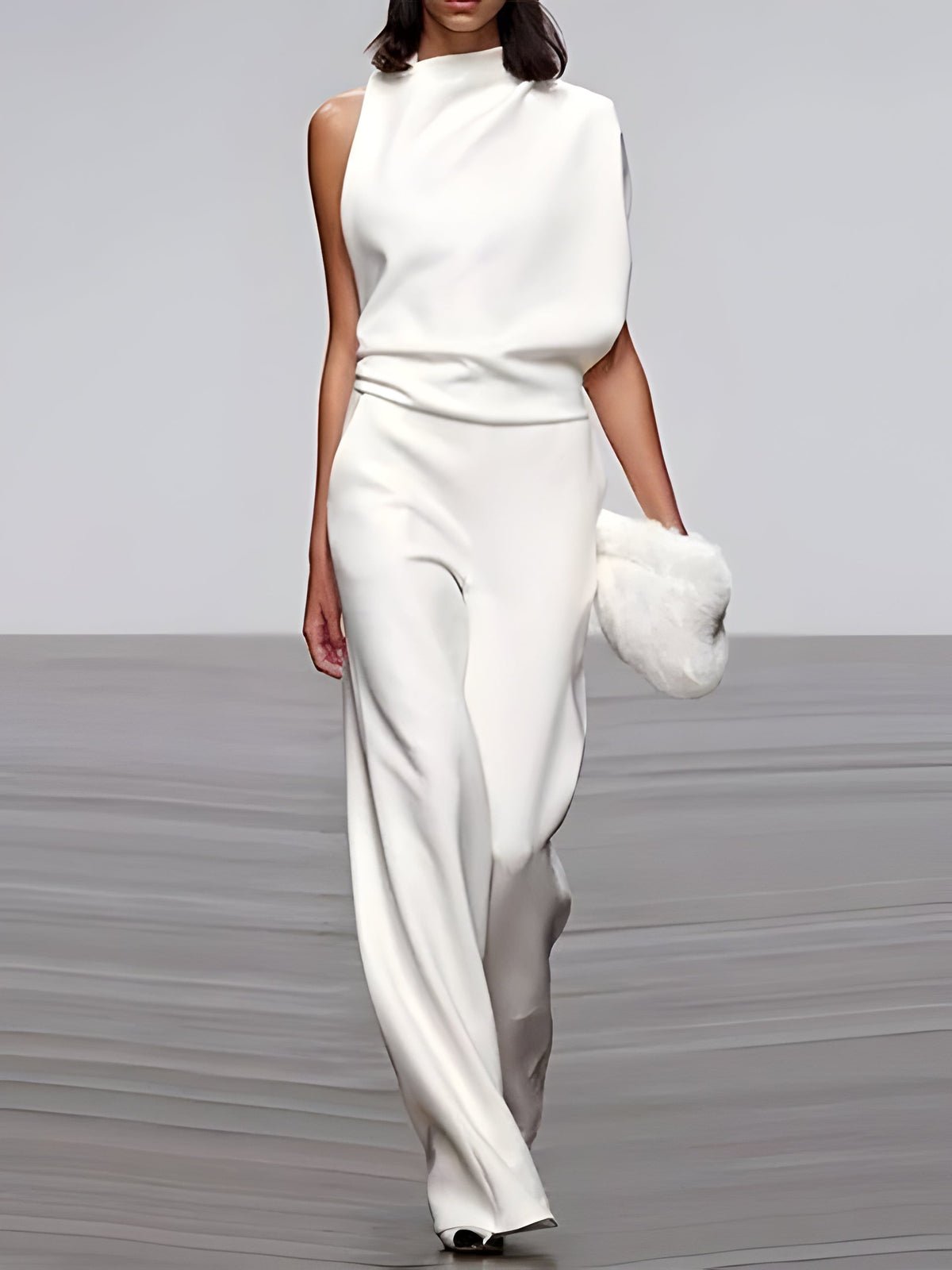Women’s sleeveless round-neck jumpsuit with flared legs by Belro, shown in a stylish, light-colored fabric.
