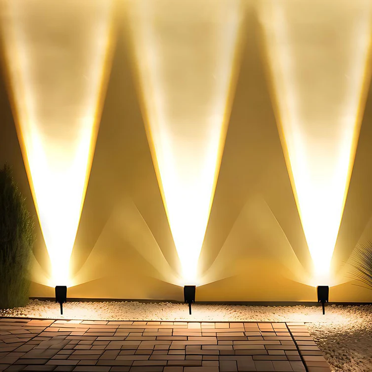 Belro waterproof LED solar multi-zoom spot light for outdoor landscape lighting with RGB color options, shown illuminating a garden area.