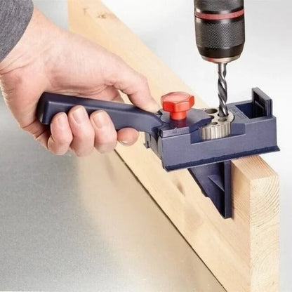 Belro dowel drill guide for precise drilling, shown with adjustable metal arms and measurement markings for woodworking projects.
