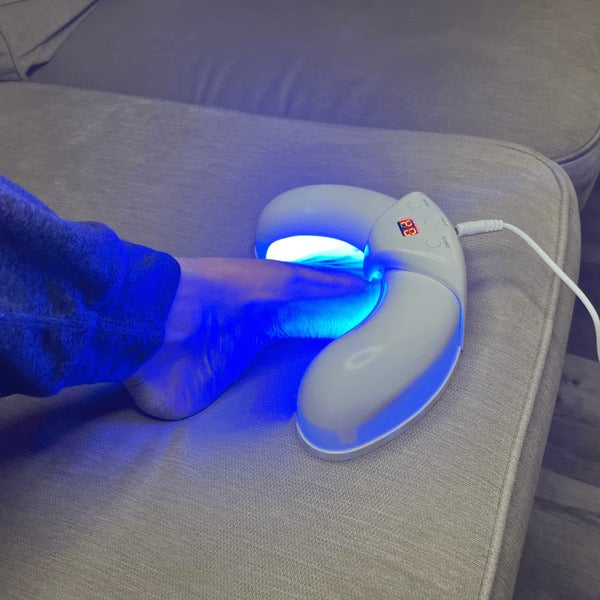 Belro Nail Laser Fungus Device used on toenail for fungal treatment, with a sleek, handheld design in the health and beauty category.