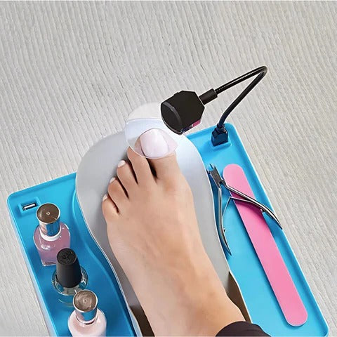 Belro adjustable pedicure rest with LED magnifier, featuring cushioned surface and bright light for detailed foot care.