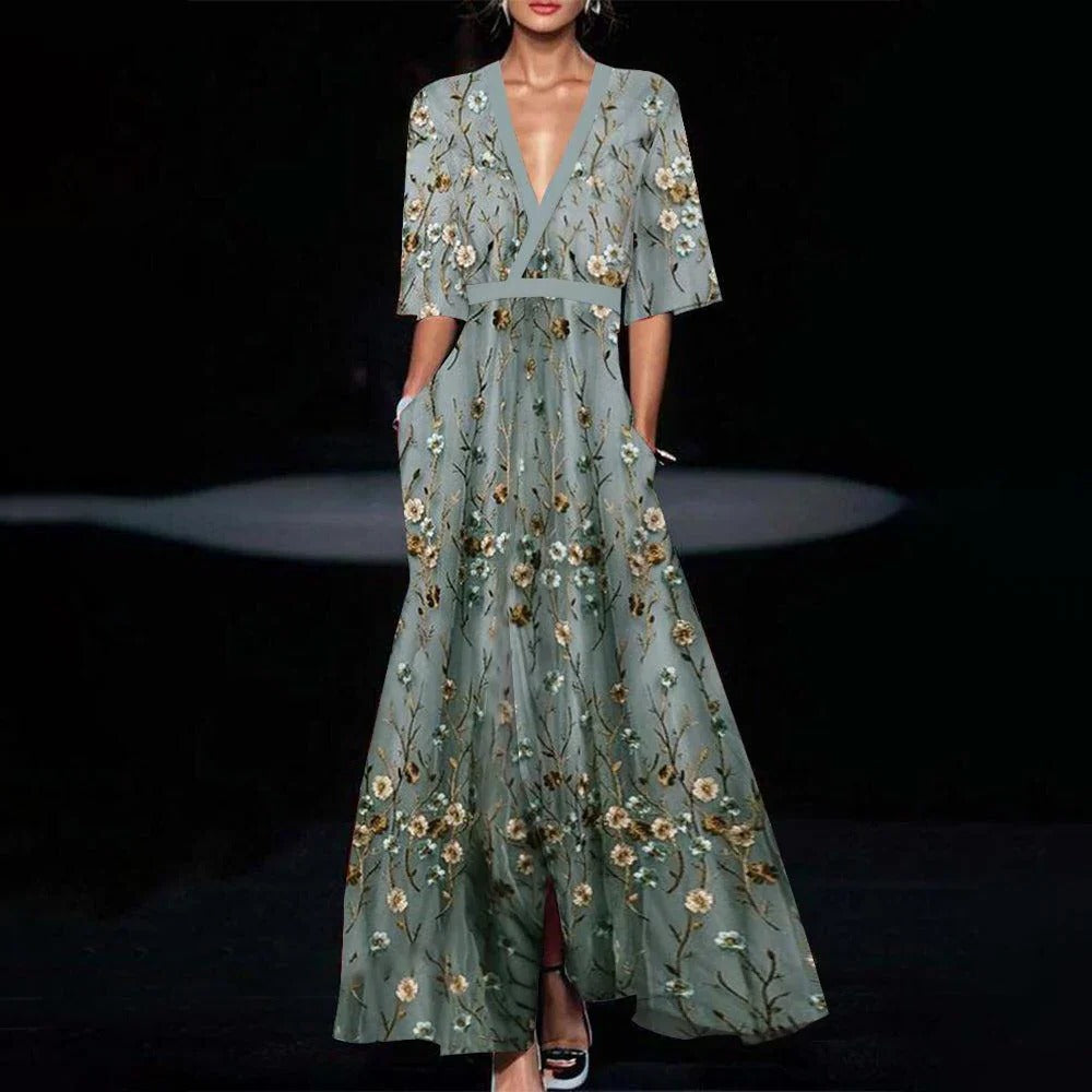 Youthful green long dress with half sleeves by Belro, featuring a flowing fabric and elegant design for casual or semi-formal wear.