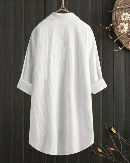 Women's white linen blouse by Belro, featuring a relaxed fit, short sleeves, and lightweight breathable fabric, perfect for casual wear.