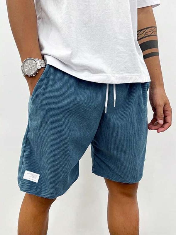 Men's Belro corduroy leisure shorts in a neutral color, displayed on a hanger with a casual fit and textured fabric.