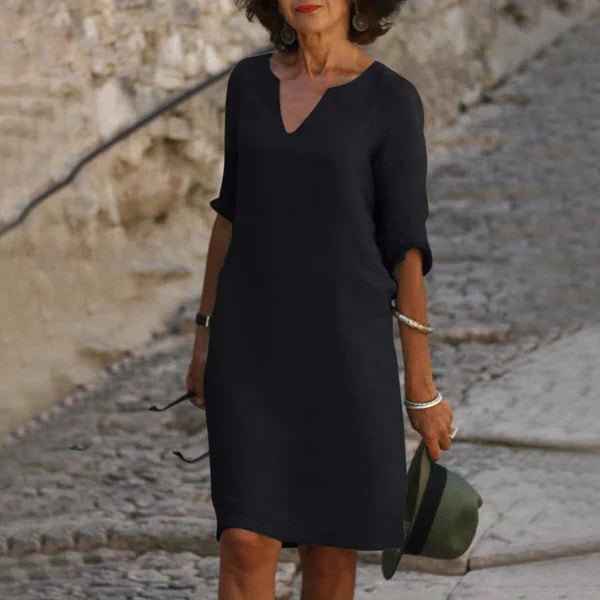 Belro V-neck three-quarter sleeve dress showing a fitted silhouette and soft fabric in a neutral color.