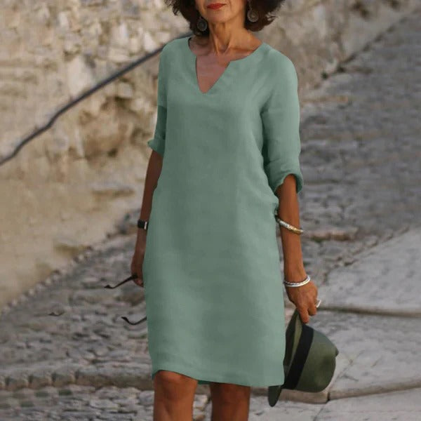 Belro V-neck three-quarter sleeve dress, stylish and comfortable clothing for women, shown in a flattering fit and elegant design.