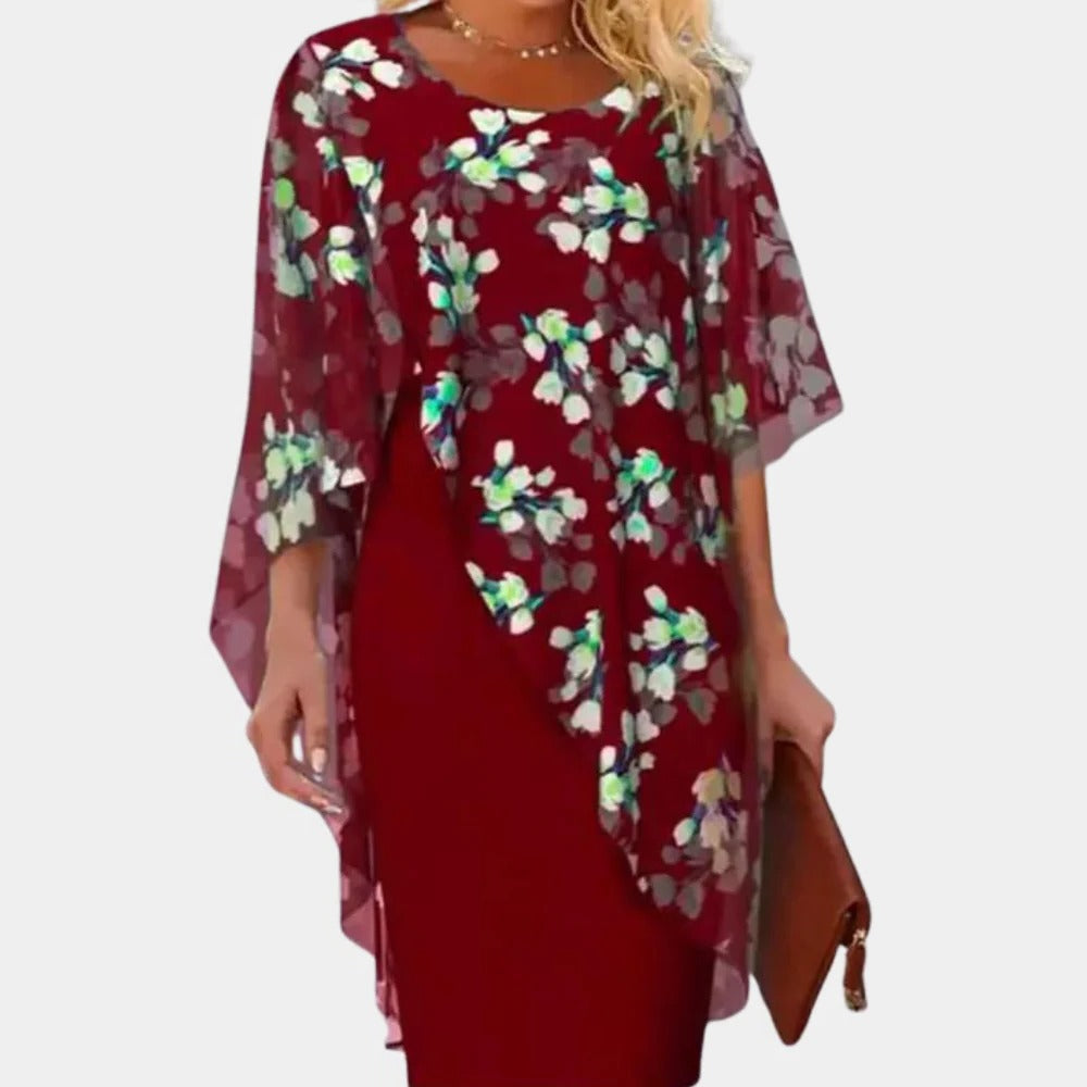 Elegant floral dress for women by Belro, featuring a flowy fabric with a vibrant floral pattern and a classic fit.