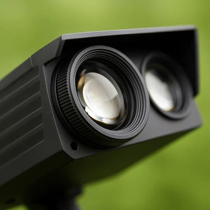 Belro Solar LED Multi-Zoom Spot Light illuminating a garden area with adjustable focus and sleek outdoor design.