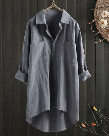 Women's white linen blouse by Belro, shown on a hanger with a relaxed fit and lightweight fabric, perfect for casual or summer wear.