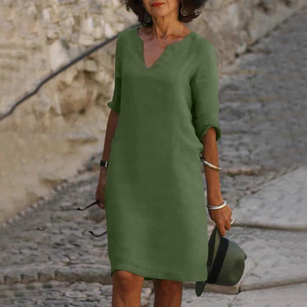 Belro V-neck three-quarter sleeve dress hanging on a mannequin, showcasing a stylish and elegant clothing dress.