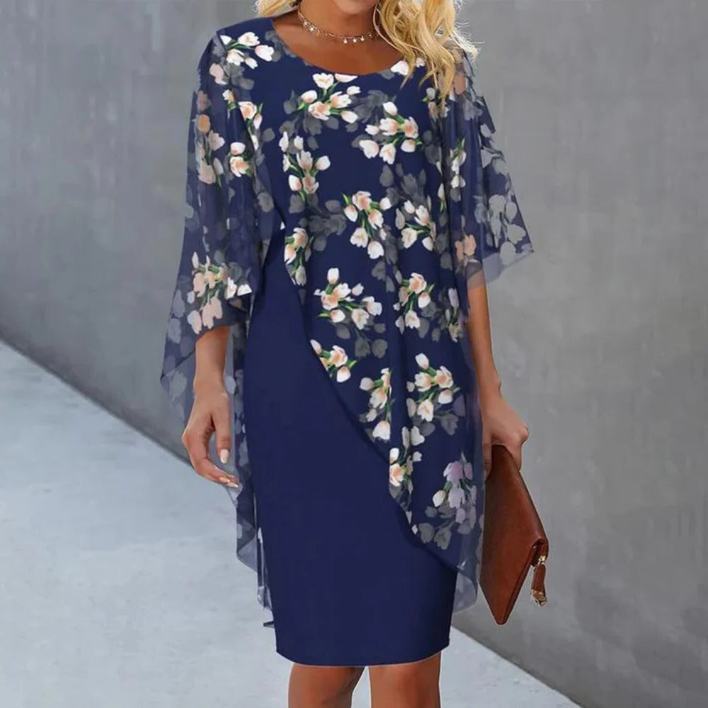 Elegant floral dress for women by Belro, featuring a flowy design with colorful flower patterns, perfect for casual or semi-formal wear.