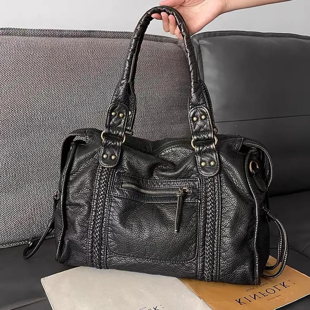 Black Belro handbag for classes, featuring sleek design and compact wallet style, with a zip closure and stylish look.