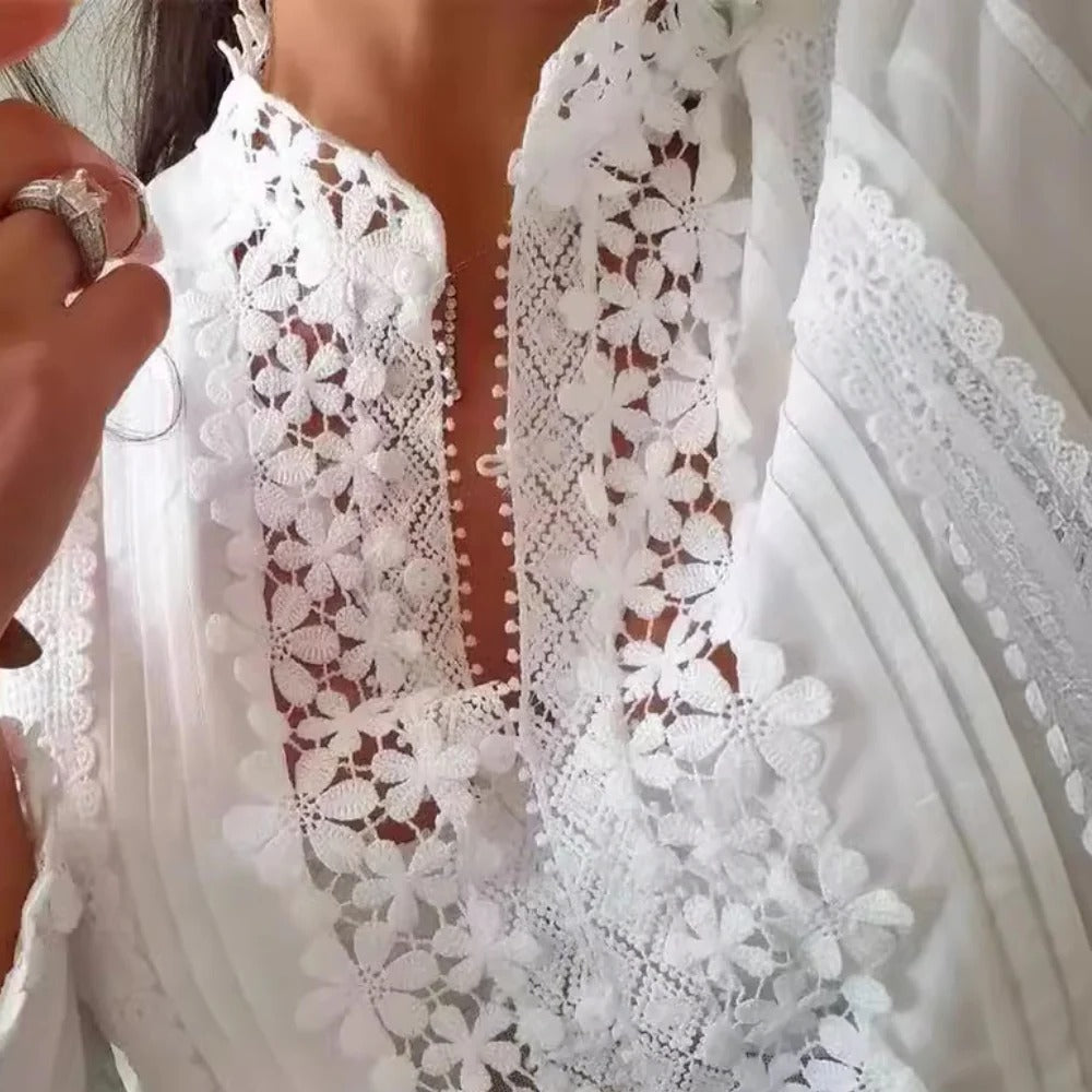 Elegant Belro women's blouse featuring a stylish, flowing design in soft fabric, perfect for casual or dressy outfits.