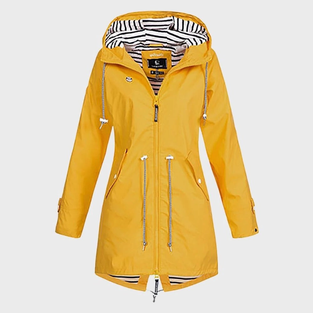 Belro long women's rain jacket displayed outdoors, lightweight waterproof clothing for wet weather protection.