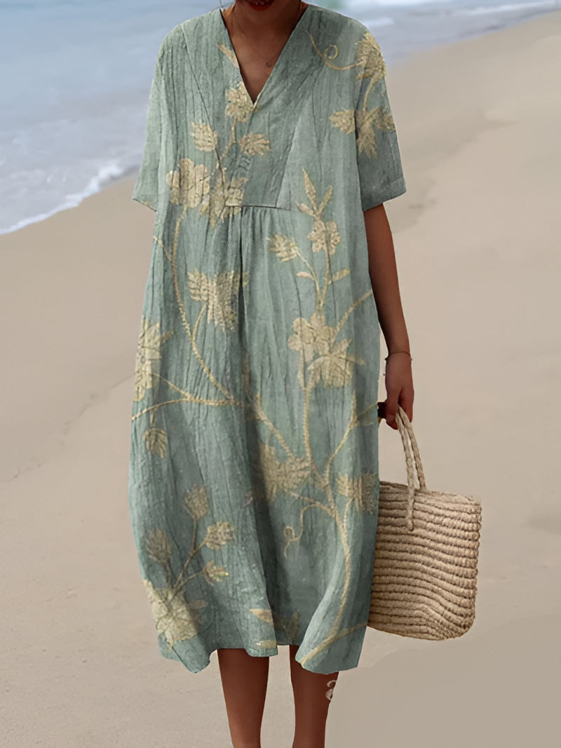 Bright, flowy summer dress by Belro featuring a floral pattern and lightweight fabric, perfect for warm weather and outdoor wear.