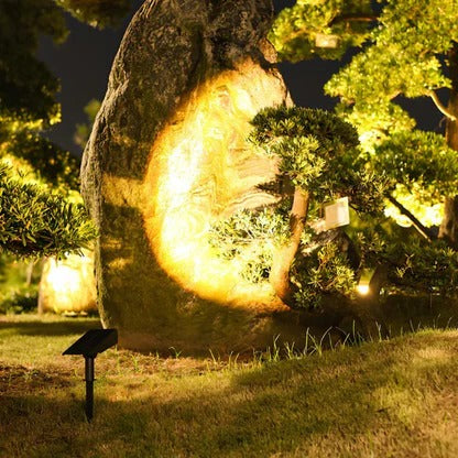 Belro Solar LED Multi-Zoom Spot Light installed outdoors, illuminating garden or landscape with adjustable zoom feature.