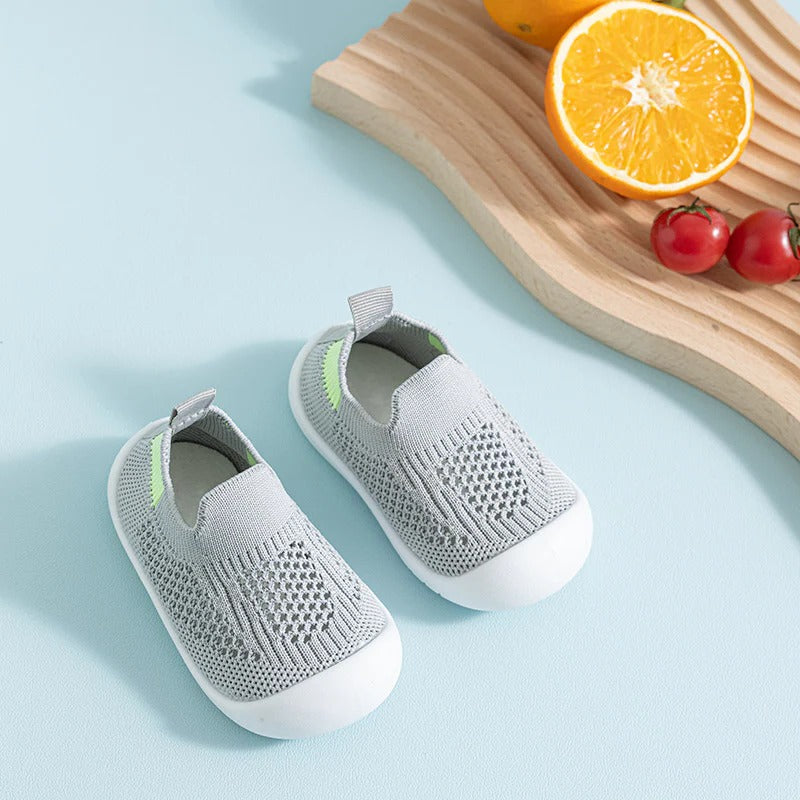 Belro anti-slip kid's socks with grippy soles, soft fabric, and colorful patterns designed for safety and comfort.