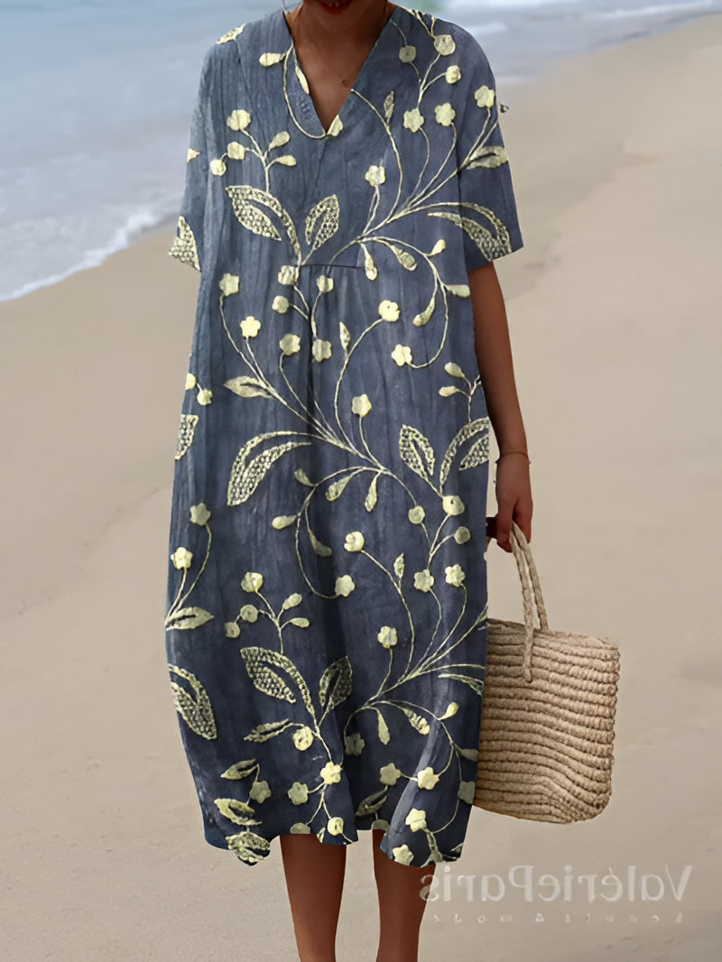 Belro summer dress featuring a vibrant floral pattern, sleeveless design, and lightweight fabric perfect for warm weather.