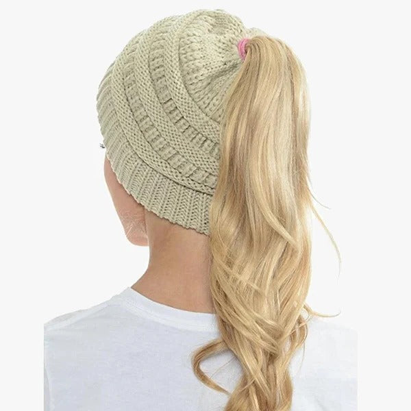 Belro ponytail beanie with ribbed knit design, showcasing a messy bun hairstyle and solid color cap for women.