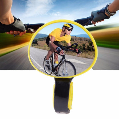 Belro bicycle handlebar mirror mounted on a bike handlebar, outdoor setting, showing reflective surface for rear view safety.