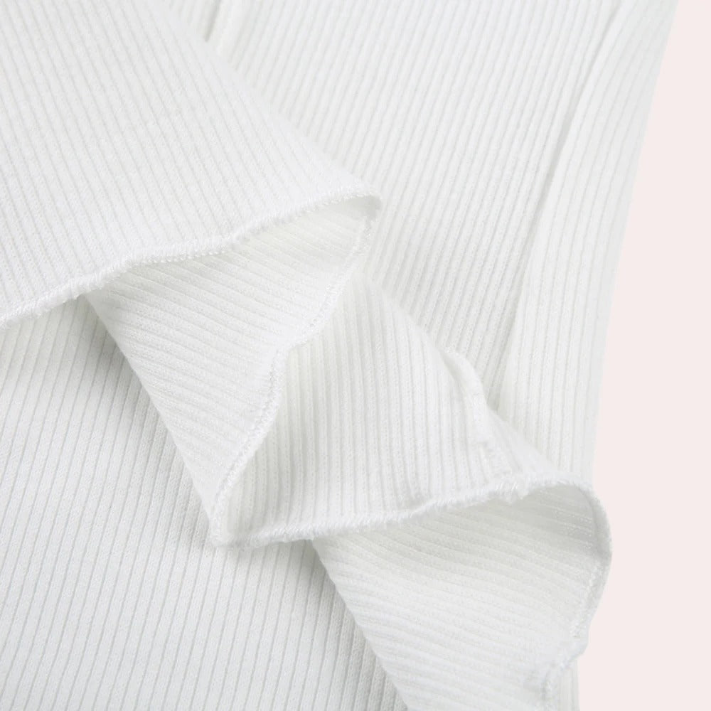 Belro simple long sleeve women's top in soft fabric, shown in a neutral color with a classic round neckline and relaxed fit.