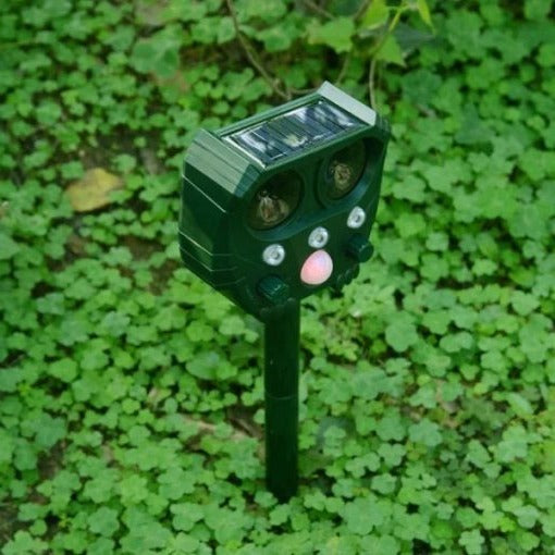 Belro ultrasonic solar snake repeller in outdoor garden setting, demonstrating pest control device for snake deterrence.
