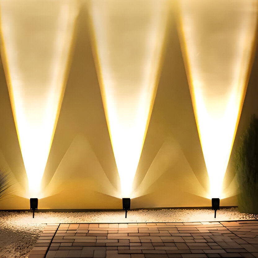 Belro Solar LED Multi-Zoom Spot Light installed outdoors, illuminating garden area with adjustable focus for outdoor home lighting.