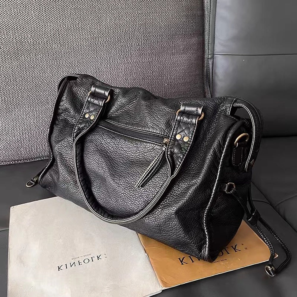 Black Belro handbag for classes, compact accessory with sleek design, perfect for carrying essentials and cards.