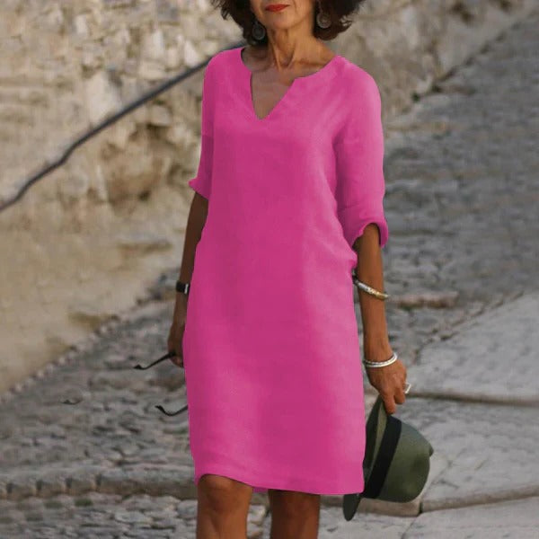 Belro V-neck three-quarter sleeve dress in soft fabric, displayed on a mannequin with a fitted silhouette.
