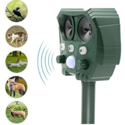 Belro ultrasonic solar snake repeller in outdoor garden setting, showing device with solar panel and pest control features