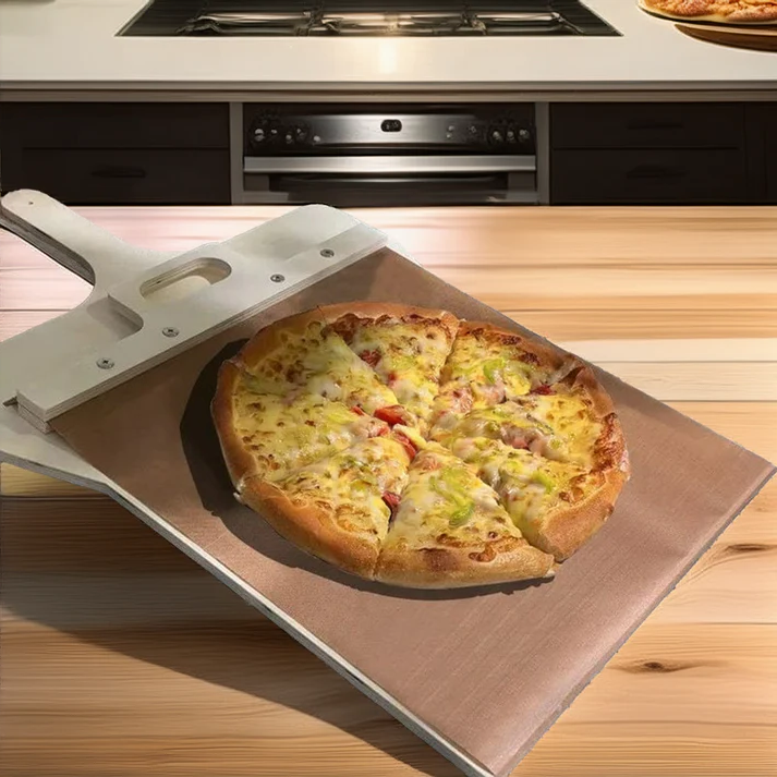 Belro sliding pizza peel for easily transferring and serving homemade pizza on a wooden surface.