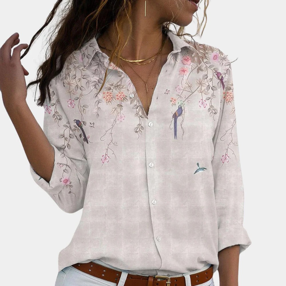 Floral ladies blouse by Belro featuring a colorful, patterned top with long sleeves and a relaxed fit.