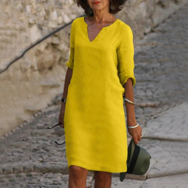 Belro V-neck three-quarter sleeve dress displayed on a hanger, showcasing its stylish neckline and elegant fit.