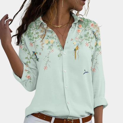Floral Belro ladies blouse with long sleeves and a V-neck, featuring a colorful floral pattern, casual and stylish top for women.
