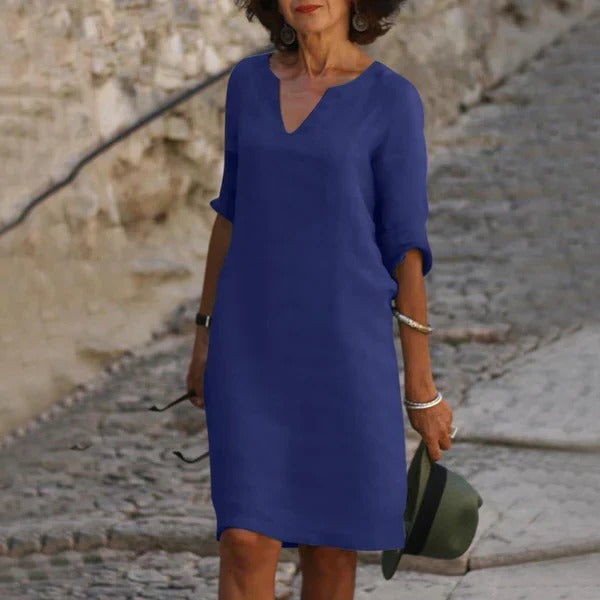 Belro V-neck three-quarter sleeve dress, stylish and elegant, shown on a model with a fitted silhouette and soft fabric.