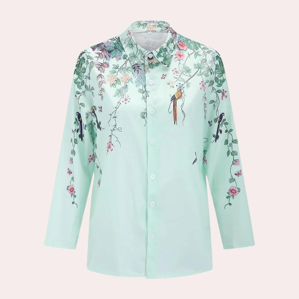 Floral Belro ladies blouse with long sleeves and V-neck, featuring vibrant flower patterns on lightweight fabric.
