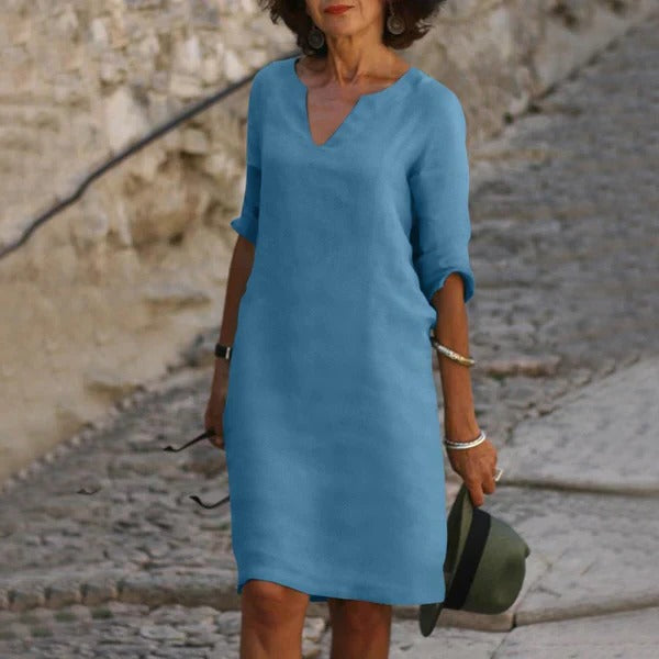 Belro v-neck three-quarter sleeve dress with a flowing silhouette, displayed on a hanger against a plain background.