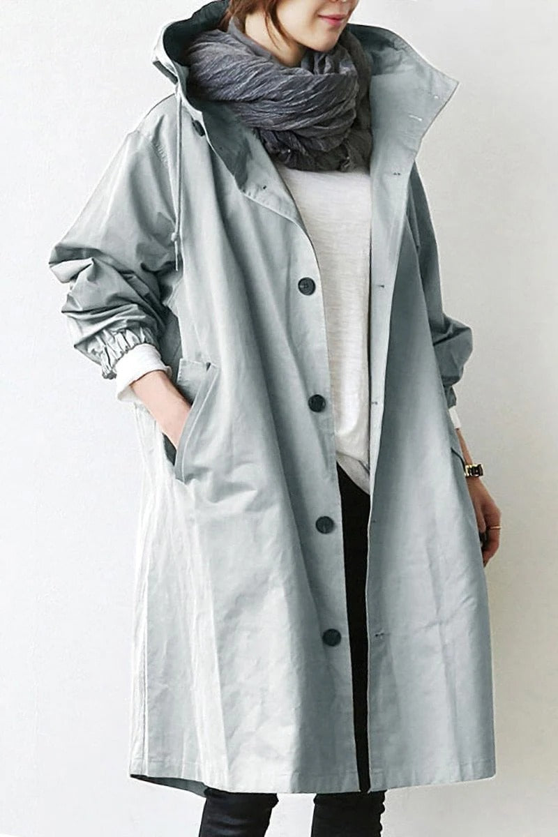 Belro hooded waterproof trench coat displayed on a hanger, showing the rain-resistant fabric and classic design.