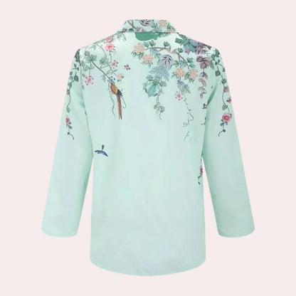 Belro floral ladies blouse featuring a colorful, flowy fabric with long sleeves and a relaxed fit, perfect for casual wear.