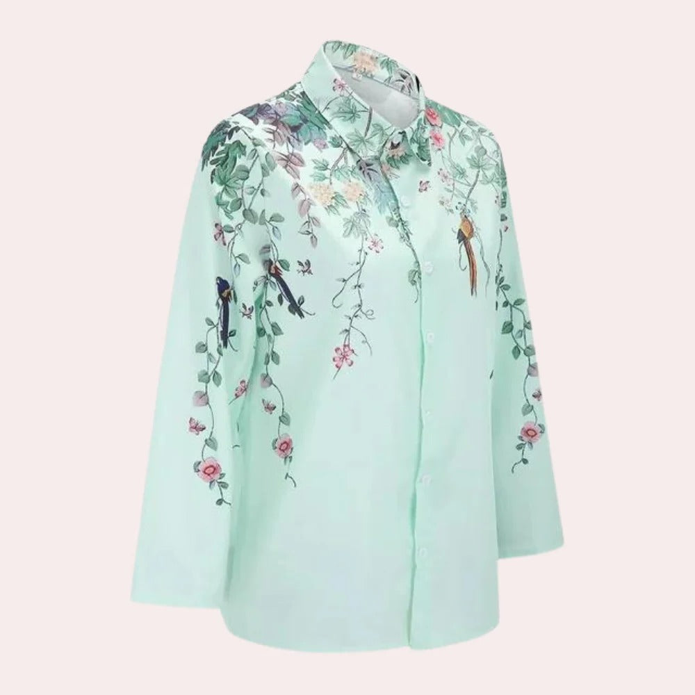 Floral ladies blouse by Belro featuring a colorful floral pattern, long sleeves, and a relaxed fit.