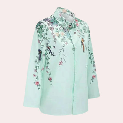 Floral ladies blouse by Belro featuring a colorful floral pattern, long sleeves, and a relaxed fit.