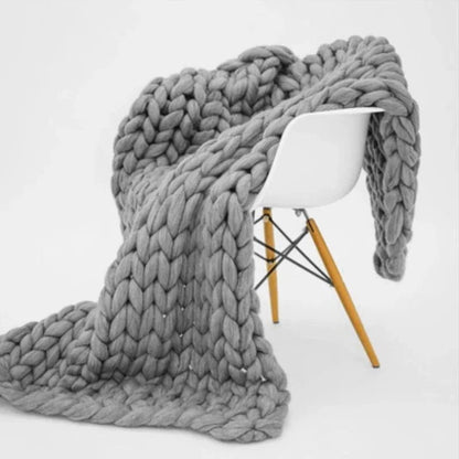 Belro winter blanket with soft, cozy fabric draped over a bed, perfect for keeping warm during cold nights.