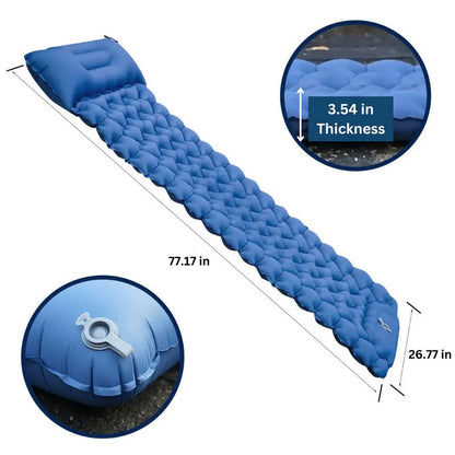 Belro ultralight compact sleeping pad for outdoor camping, shown rolled out in a natural outdoor setting.